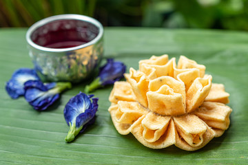 Thai homemade crispy Lotus blossom cookie delicious snack. Thai traditional snack.