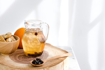 Bubble milk tea with milk  and bubble topping for tea or other beverage on the wood table with copy-space for text.