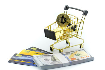 Bitcoins with credit card and money dollars of shopping cart,Online shopping concept.