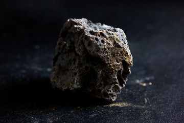 Basalt rock isolate on black background