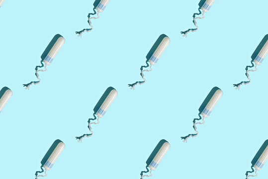 Hygiene Female Tampon Pattern On Blue Background.