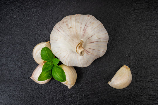 garlic with basil on slate dish