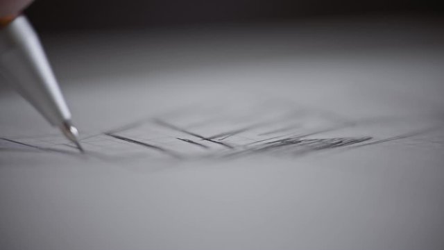 Male architect at work. Architect Hands. Pencil in hand of architect. Engineer works with drawings. Artist drawing with pencil. Close-up view