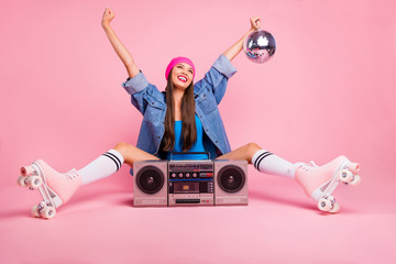 Full size photo of charming girl holding glittering disco ball feeling rejoice raising hands...