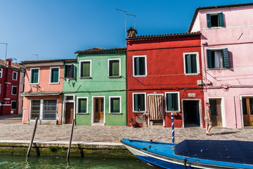 Fototapeta na wymiar Colored houses on the Bank of a narrow channel