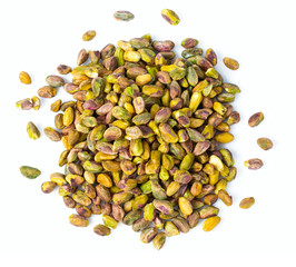 raw pistachio nuts isolated on white