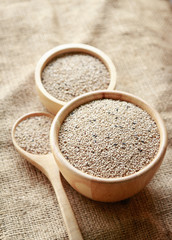 raw sesame on wooden bowl for healthy ingredient in cooking 