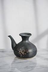 Traditional ceramic teapot  on natural light  background