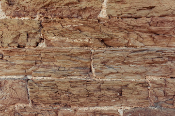 Brown brick wall outdoor background. Stone texture.