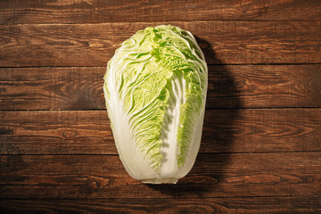 Fresh Peking cabbage lying on the table. Dietary nutrition.