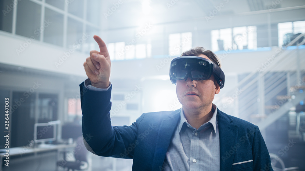 Aufkleber automotive engineer using augmented reality headset making touching gestures. in innovation laborato