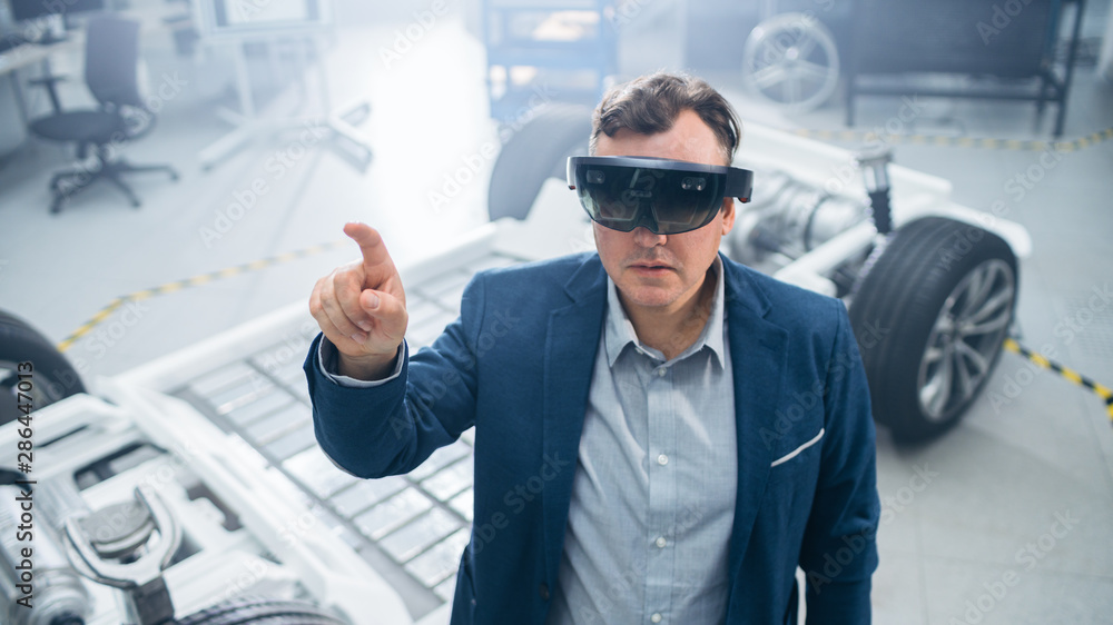 Aufkleber automotive engineer using augmented reality headset making touching gestures. in innovation laborato