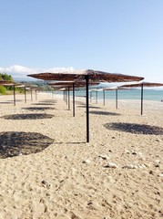 beach with umbrellas and sunbeds on beach
