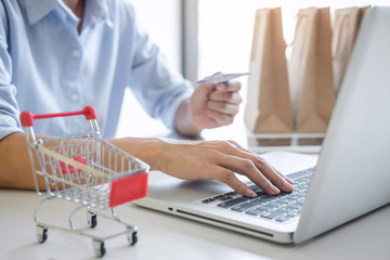 Woman using credit card register security code and payments online shopping and customer service network connection market, using on laptop, Internet Online shopping or internet banking concept