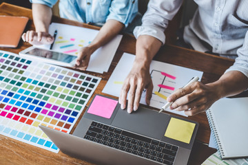 Team of Creative Web/Graphic Designer planning, drawing website ux app for mobile phone application and development template layout, process to developing prototype wireframe, User experience concept