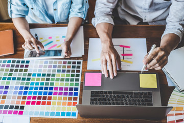 Team of Creative Web/Graphic Designer planning, drawing website ux app for mobile phone application and development template layout, process to developing prototype wireframe, User experience concept