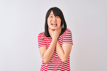 Young beautiful chinese woman wearing red striped t-shirt over isolated white background shouting suffocate because painful strangle. Health problem. Asphyxiate and suicide concept.