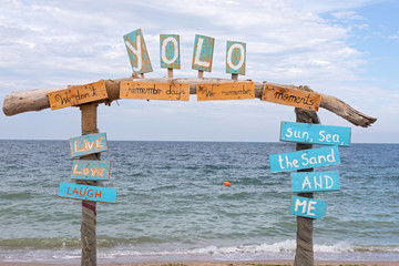Yolo sign at Vama Veche - obrazy, fototapety, plakaty