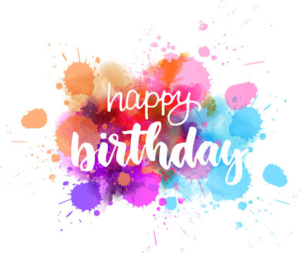 Happy birthday lettering on colorful paint splash