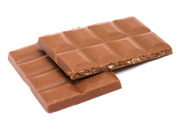 Milk chocolate bar with nut filling in half isolated on white background