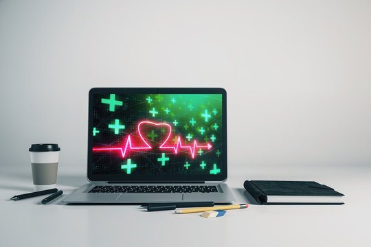 Laptop closeup with human heart drawing on computer screen. Education concept. 3d rendering.