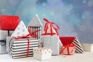  Christmas or party background with gift boxes, ribbons, decorations in silver, red and black...