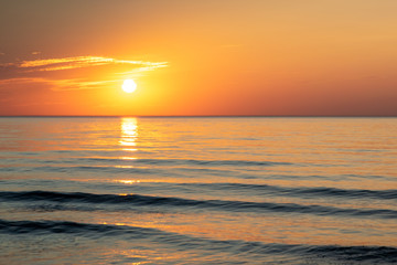 Obraz premium Sunset on the sea beach, beautiful view sunset, evening at the beach by the sea