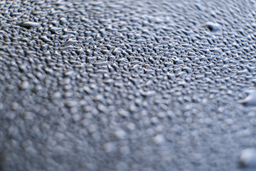 drop of water on a car glass. abstraction pattern