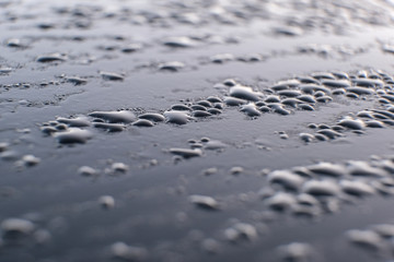 drop of water on a car glass. abstraction pattern