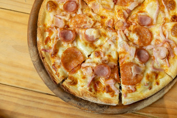 Pepperoni Pizza on the Wood Table. Famous and Tasty iTalian Style Food