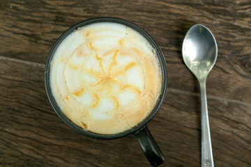 Cappuccino Coffee on the Teak Wood Table in the Morning