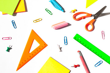 Colorful School stationery concept flat lay on the white paper background. Top view. 
