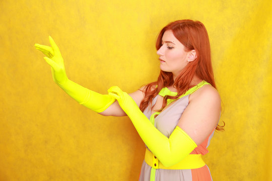 cute fashion lady with long satin fashion yellow gloves