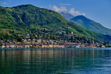 Fototapeta na wymiar Panoramic view of the center of Salo on Lake Garda, Italy. Reflections of city buildings by the water .