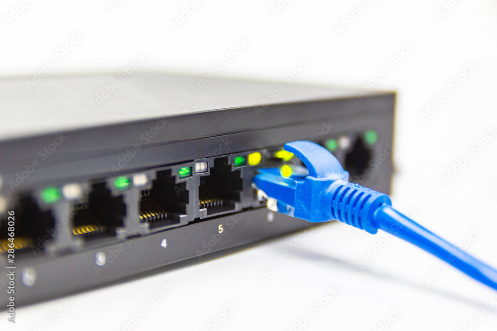 Poster the blue network cables connect port switch on white table concept internet network connection