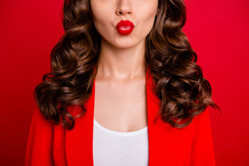 Cropped photo of beautiful lady sending air kiss dressed formal-wear jacket isolated burgundy background