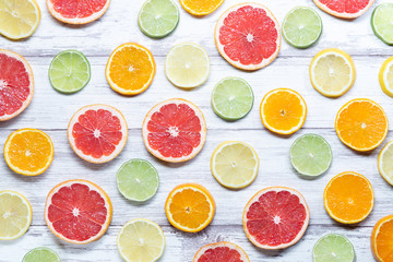 Colorful fruits backround. .citrus slices,orange, lemon, lime, and grapefruit. white wooden...