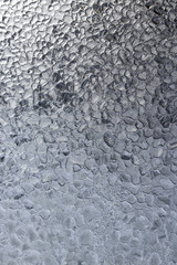 Frosty pattern on the glass. Thin ice crystals on the window gla