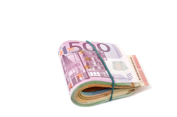 folded euro banknotes isolated on a white background. Euro banknotes tied with an elastic band. Close-up.