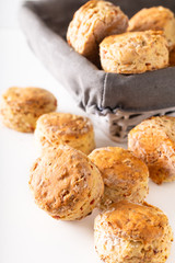 Food concept Fresh baked Homemade buttery, salty Ham and cheese scones on white background.