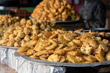 Heap of fried indian samosa on buffet table, India