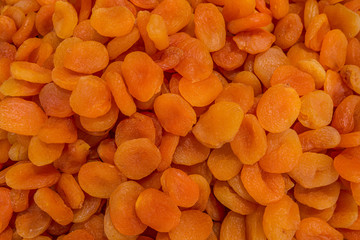 abstract background of sweet dried apricots in the market close up