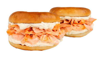 Salmon and cream cheese filled bagels isolated on a white background