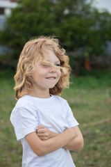 Funny blond kid with long hair