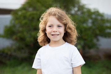 Funny blond kid with long hair