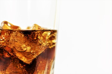 glass of cola with ice isolated on white background