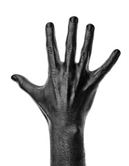 Black hand on white background, isolated, paint. ..Male hand isolated on black background. Hand showing symbols and gestures.