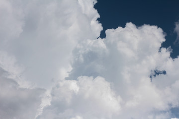 Large cumulus cloud in the dark blue sky. Close-up.  