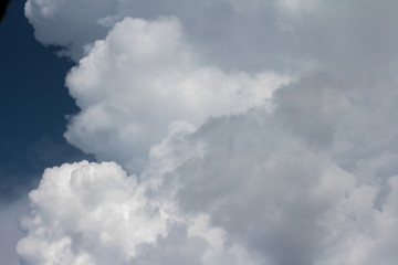 Large cumulus cloud in the dark blue sky. Close-up.  