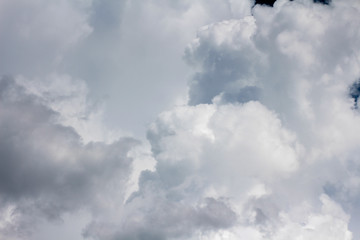 Large cumulus cloud in the dark blue sky. Close-up.  